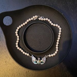 VIVIENNE WESTWOOD UNISEX WINGED PEARL NECKLACE